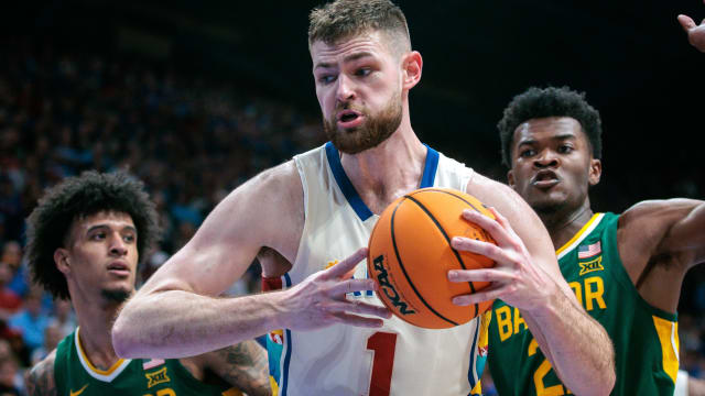 Feb 10, 2024; Lawrence, Kansas, USA; Kansas Jayhawks center Hunter Dickinson (1) protects the ball during the second half against the Baylor Bears at Allen Fieldhouse. Mandatory Credit: William Purnell-USA TODAY Sports  